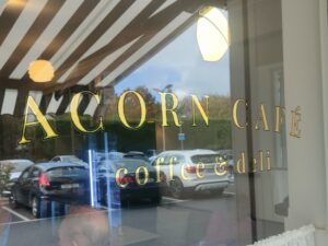 Gold leaf window sign at Acorn Cafe