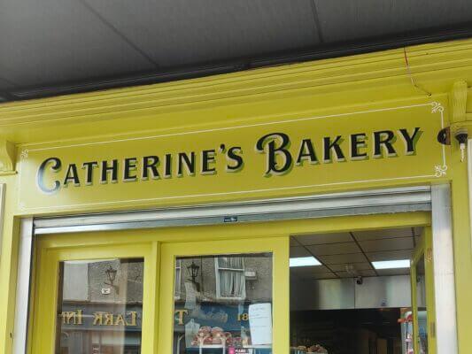 Handpainted shopfront sign